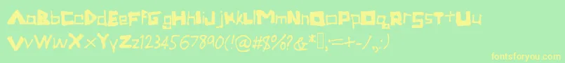 フォントTronica – 黄色の文字が緑の背景にあります