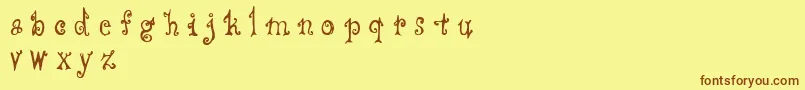 フォントCffredostyle – 茶色の文字が黄色の背景にあります。