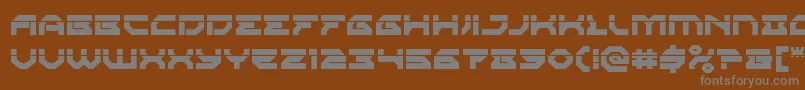 Xenodemonlaser-fontti – harmaat kirjasimet ruskealla taustalla