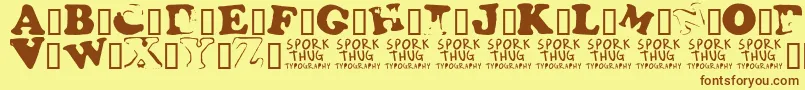 フォントFridgeMagnets – 茶色の文字が黄色の背景にあります。