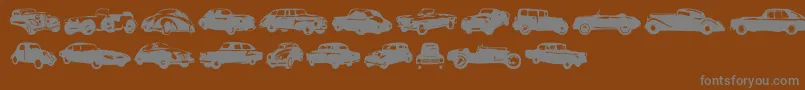 Linotypeharrycars-Schriftart – Graue Schriften auf braunem Hintergrund