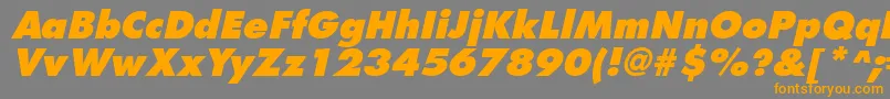 フォントFuturistextraboldItalic – オレンジの文字は灰色の背景にあります。