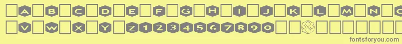 AlphashapesHexagons3 Font – Gray Fonts on Yellow Background