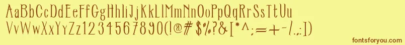 フォントTreeftr – 茶色の文字が黄色の背景にあります。