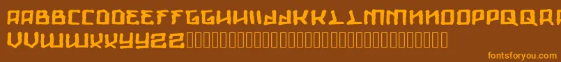 フォントGiants – オレンジ色の文字が茶色の背景にあります。