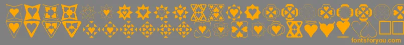 フォントHeartthings – オレンジの文字は灰色の背景にあります。
