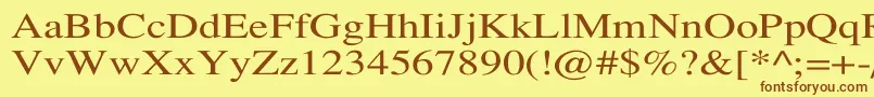 フォントTempofontWd – 茶色の文字が黄色の背景にあります。