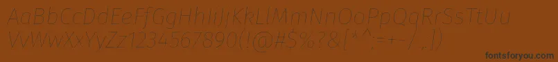 Czcionka FirasansHairitalic – czarne czcionki na brązowym tle