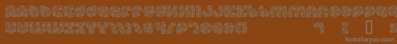 Dreamlas-fontti – harmaat kirjasimet ruskealla taustalla