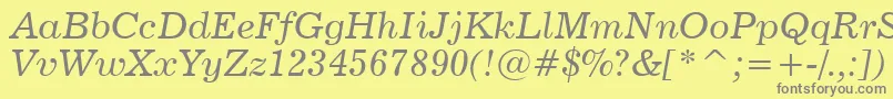 News702ItalicBt Font – Gray Fonts on Yellow Background