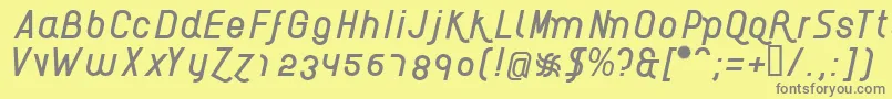 フォントAikelsoI – 黄色の背景に灰色の文字