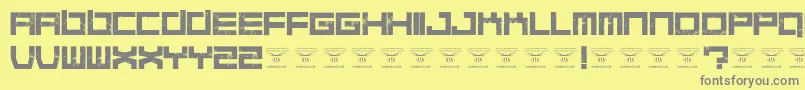 Fonte QuaaludesRegular – fontes cinzas em um fundo amarelo