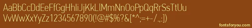 PfdintextcondproThin-fontti – keltaiset fontit ruskealla taustalla