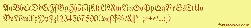 フォントTheuerdankFraktur – 茶色の文字が黄色の背景にあります。