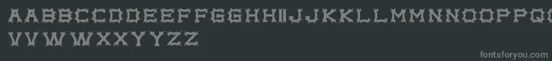 Fonte ComplexBrujaFreePromo – fontes cinzas em um fundo preto