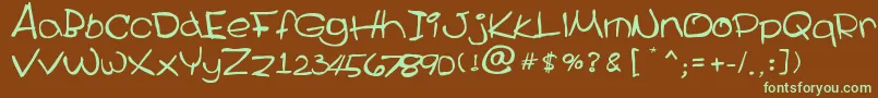 フォントCecile – 緑色の文字が茶色の背景にあります。