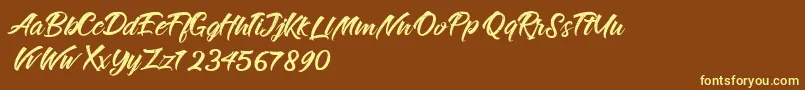 Fonte RougeMaheiraVintagePersonalUse – fontes amarelas em um fundo marrom