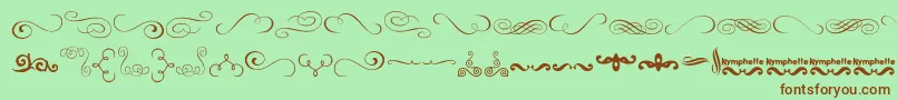 More about Nymphette Font Nymphette Font – Brown Fonts on Green Background