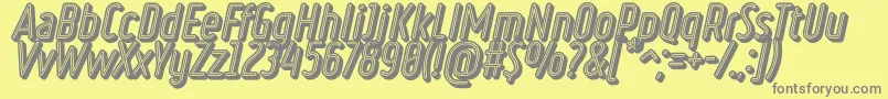 フォントRulerVolumeNeon – 黄色の背景に灰色の文字