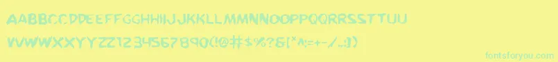 フォントKreetureWarped – 黄色い背景に緑の文字