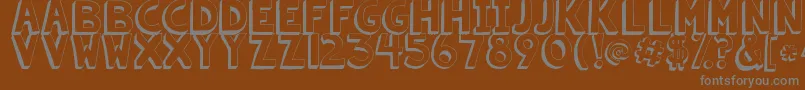 Kgsummersunshineshadow-fontti – harmaat kirjasimet ruskealla taustalla