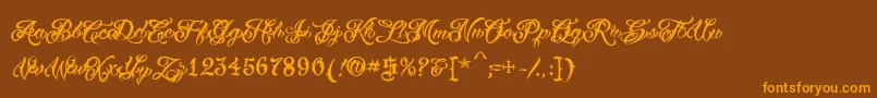Fonte VtcTattooscripttwo – fontes laranjas em um fundo marrom