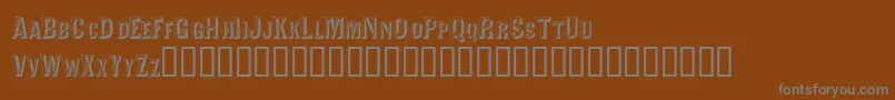 Шрифт Valdivafacetsscapsssk – серые шрифты на коричневом фоне