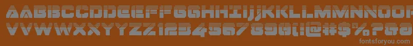 Dominojackhalf-fontti – harmaat kirjasimet ruskealla taustalla