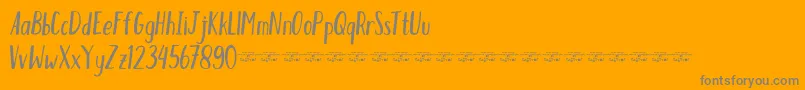 HumblefreeForPersonal-Schriftart – Graue Schriften auf orangefarbenem Hintergrund