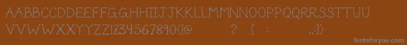 Шрифт Cutetat – серые шрифты на коричневом фоне
