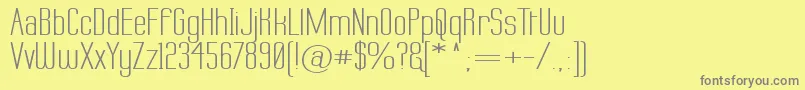 フォントLabtopw – 黄色の背景に灰色の文字