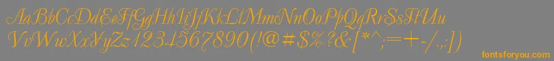 フォントDecorCyr – オレンジの文字は灰色の背景にあります。