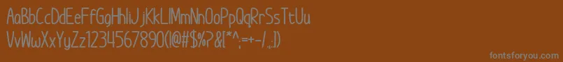 ImWunderlandBold Font – Gray Fonts on Brown Background