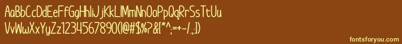 Шрифт ImWunderlandBold – жёлтые шрифты на коричневом фоне