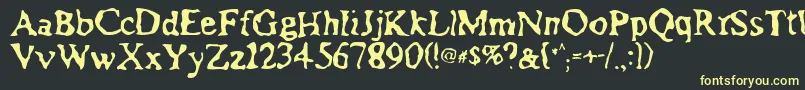 フォントAssimilation – 黒い背景に黄色の文字
