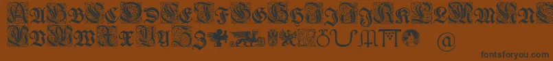 Wieynkfrakturinitialen-fontti – mustat fontit ruskealla taustalla