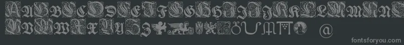 Wieynkfrakturinitialen-fontti – harmaat kirjasimet mustalla taustalla