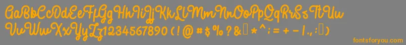 Weitere Informationen zur SweatyBeta-Schriftart SweatyBeta-Schriftart – Orangefarbene Schriften auf grauem Hintergrund