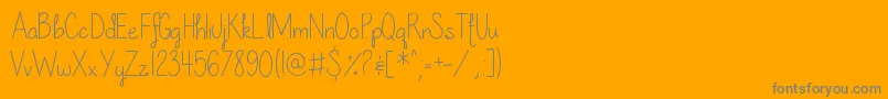 フォントOurLilSecretForever – オレンジの背景に灰色の文字