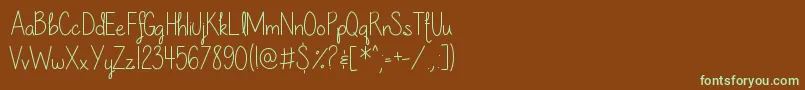 フォントOurLilSecretForever – 緑色の文字が茶色の背景にあります。