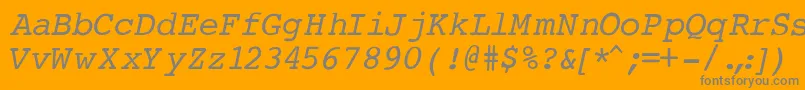 CourierNormalItalic-fontti – harmaat kirjasimet oranssilla taustalla