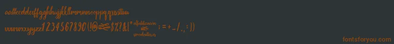 Шрифт AlfabetizaciРІn – коричневые шрифты на чёрном фоне