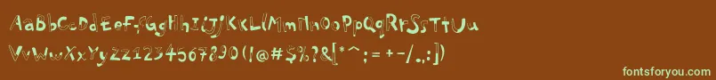フォントPfplayskoolproHalfull – 緑色の文字が茶色の背景にあります。