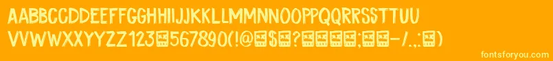 Fonte DkCoalBrush – fontes amarelas em um fundo laranja