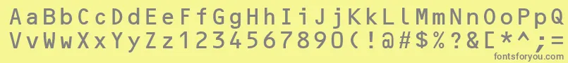 OcrBMt-fontti – harmaat kirjasimet keltaisella taustalla