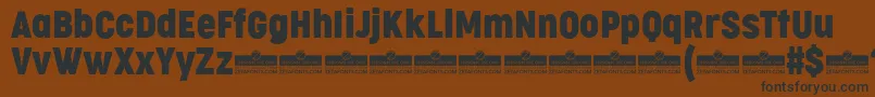 CocogooseCondensedRegularTrial Font – Black Fonts on Brown Background
