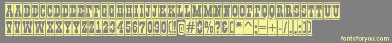 GildiadccmBold-fontti – keltaiset fontit harmaalla taustalla