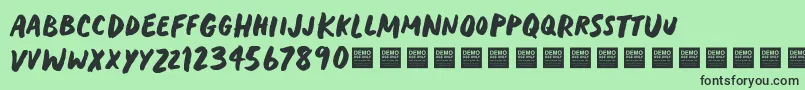 フォントHeavyTripDemo – 緑の背景に黒い文字