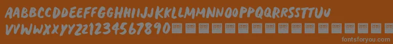 HeavyTripDemo Font – Gray Fonts on Brown Background