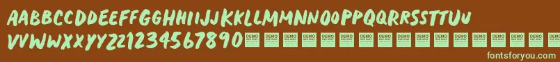 HeavyTripDemo-Schriftart – Grüne Schriften auf braunem Hintergrund